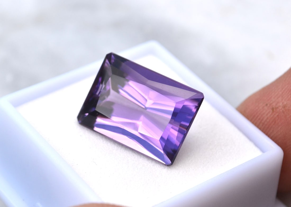 15.82 Carat Scissor Cut Amethyst: Gorgeous Amethyst. Great cut and color. Just a top jewelry grade stone. Natural and untreated. Most gems sold online aren't jewelry grade. They're either poorly cut, have weak color or too many