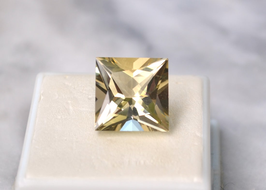 11.26 Carat Princess Cut Labradorite: Great example of a gem quality Labradorite. Fantastic cut and great color and clarity. Natural and untreated. Most gems sold online aren't jewelry grade. They're either poorly cut, have weak color or