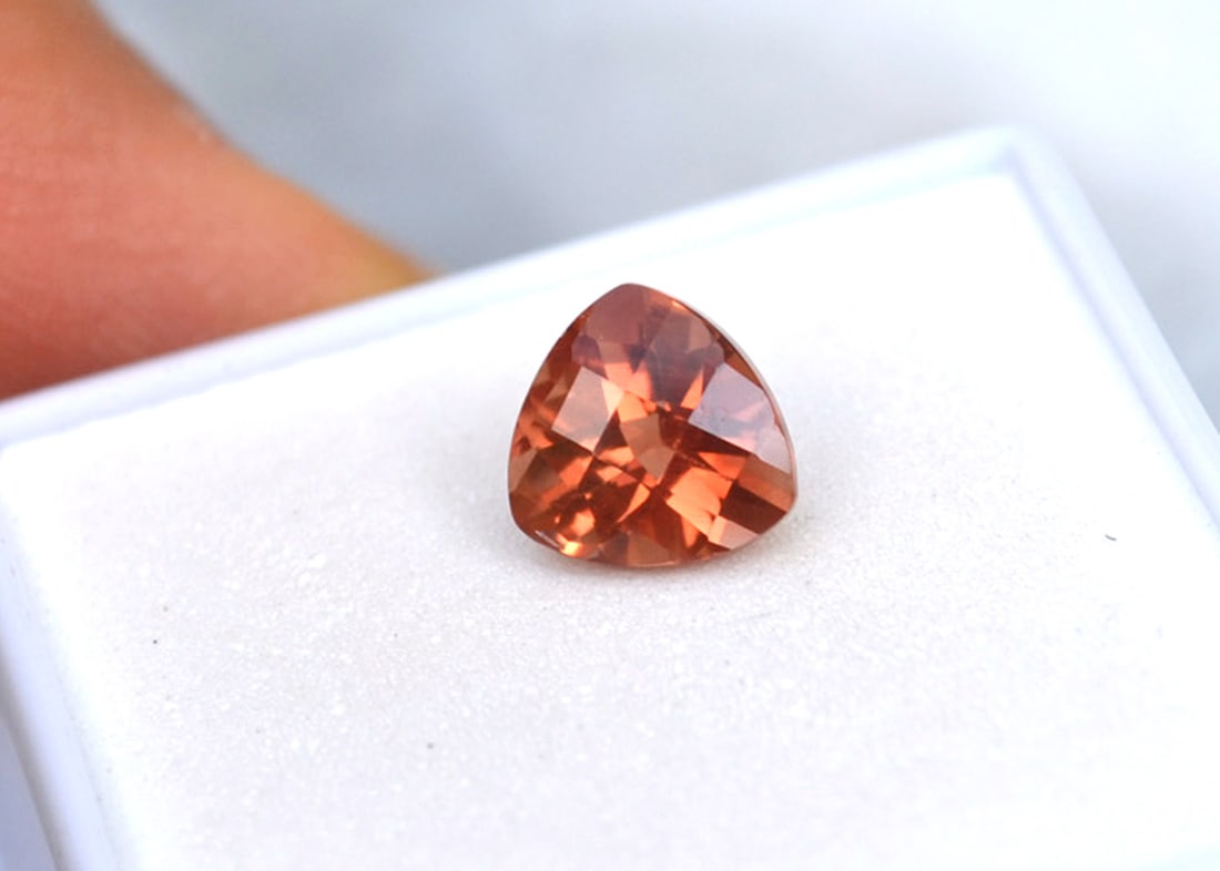 1.82 Carat Trillion Checkerboard Cut Red Sunstone: Rich Red Sunstone, most likely mined in Oregon, USA. Red Sunstone is nearly always mined in Oregon, so as you can imagine, the value is quite high. This stone has a beautiful peachy red color and a