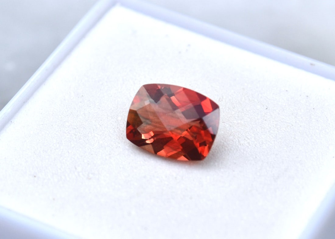 1.54 Carat Cushion Checkerboard Cut Red Sunstone: Wow, what an exceptional Sunstone, most likely mined in Oregon, USA. Red Sunstone is nearly always mined in Oregon, so as you can imagine, the value is quite high. This stone is top red color and