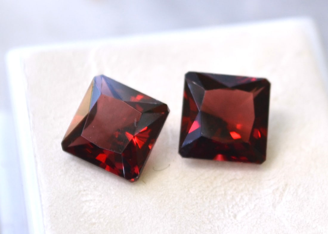 8.43 Carat Matched Pair of Princess Cut Garnets: Just a stunning pair of Garnets. Top quality in every way. Perfect for jewelry. Natural and untreated. For Proxibid bidders, shipping is a flat rate of $6, no matter how many lots won. For Live Auctio