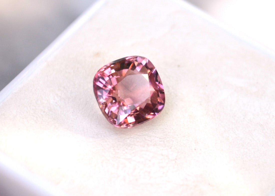 2.40 Carat Cushion Cut Pink Tourmaline: Fantastic Pink Tourmaline. Great color, cutting and clarity. Just a fantastic stone for the price. Natural and untreated. Most gems sold online aren't jewelry grade. They're either poorly cut, have