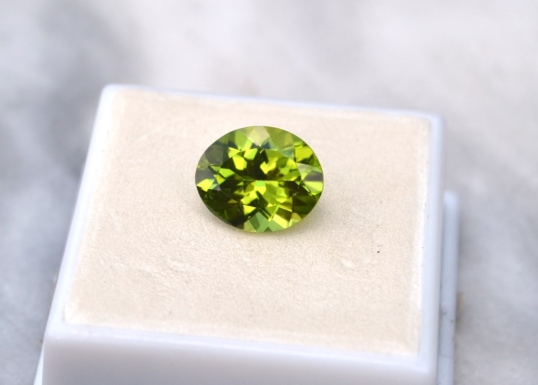 4.71 Carat Oval Cut Peridot: Beautiful Peridot. Great color and cut and mostly clean internally. Just a great stone for the price. Natural and untreated. Most gems sold online aren't jewelry grade. They're either poorly cut, have