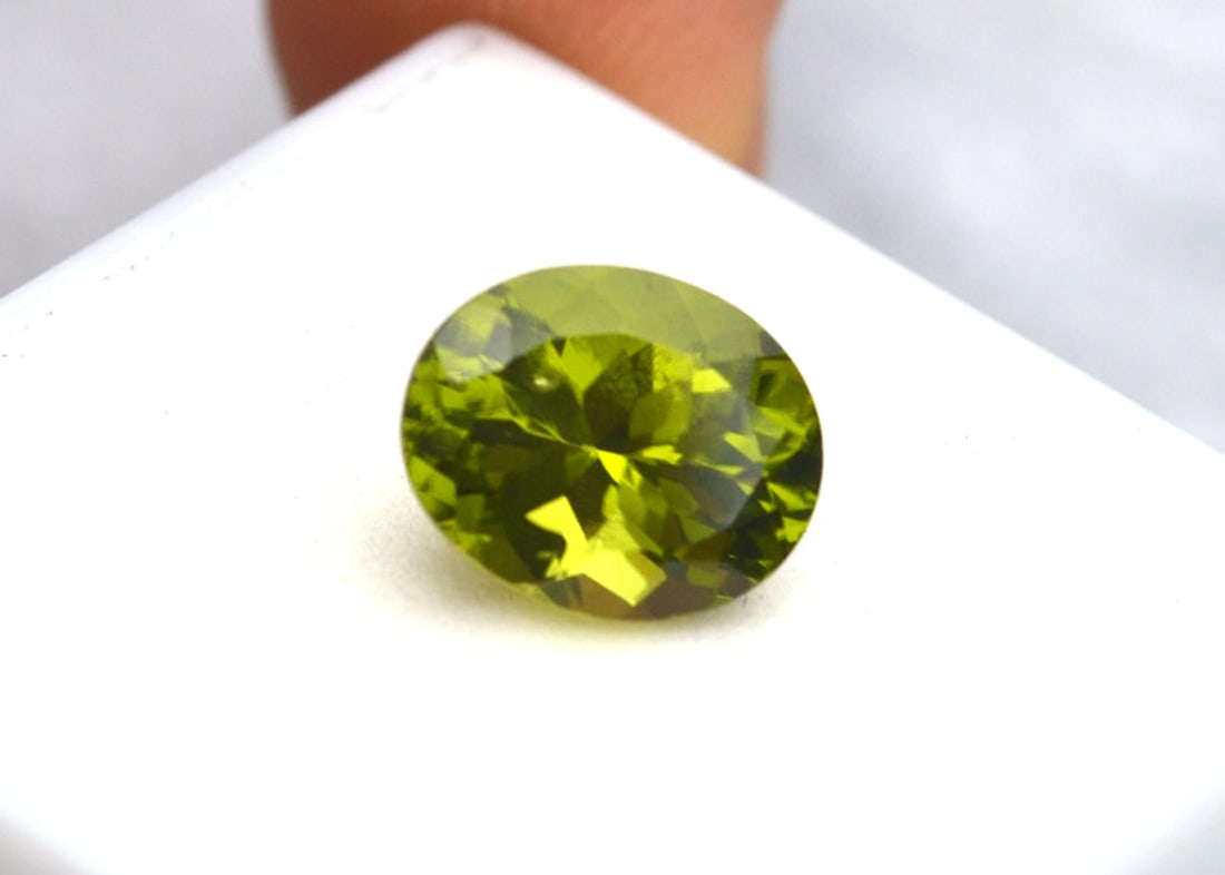 4.33 Carat Oval Cut Peridot: Gorgeous Peridot with great color, clarity and cut. Natural and untreated. Most gems sold online aren't jewelry grade. They're either poorly cut, have weak color or too many inclusions, giving them