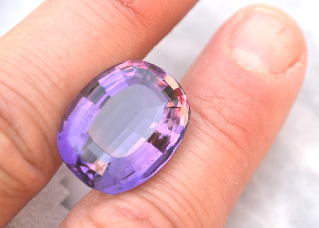 29.16 Carat Cushion Cut Old Stock Amethyst: Fantastic Amethyst. Old stock stone from a private collection. Natural and untreated. Most gems sold online aren't jewelry grade. They're either poorly cut, have weak color or too many inclusions,