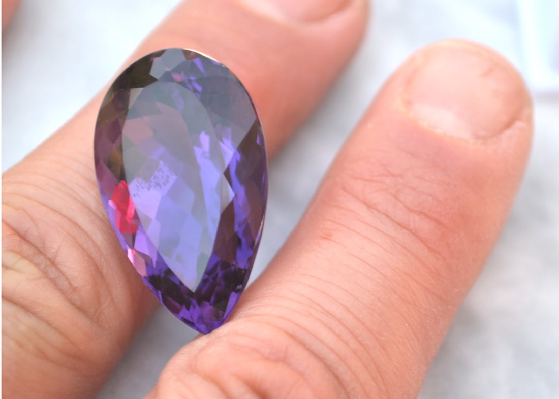 34.19 Carat Pear Cut Old Stock Amethyst: Fantastic Amethyst. Old stock stone from a private collection. Natural and untreated. Most gems sold online aren't jewelry grade. They're either poorly cut, have weak color or too many inclusions, giv