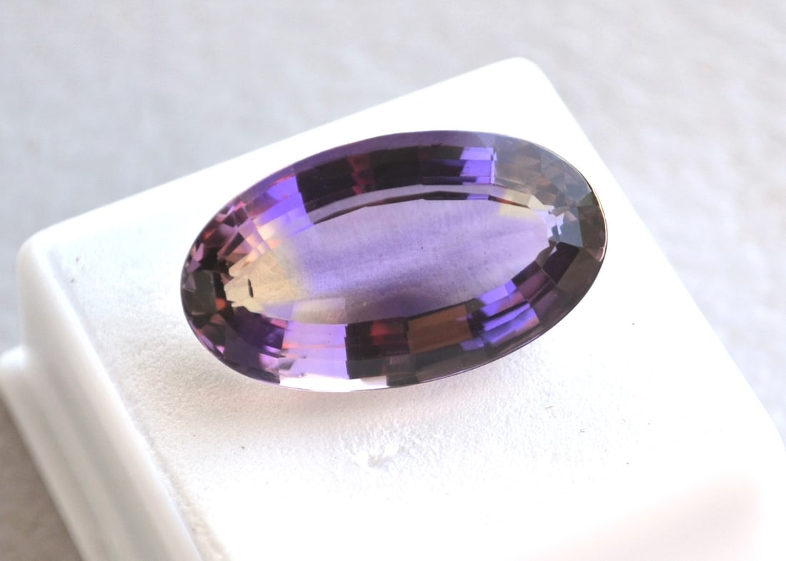24.52 Carat Antique Oval Cut Old Stock Ametrine: Gorgeous Ametrine. Rich color with a fantastic cut. Would be an amazing stone to set in jewelry. Old stock stone from a private collection. Natural and untreated. Most gems sold online aren't jewelry