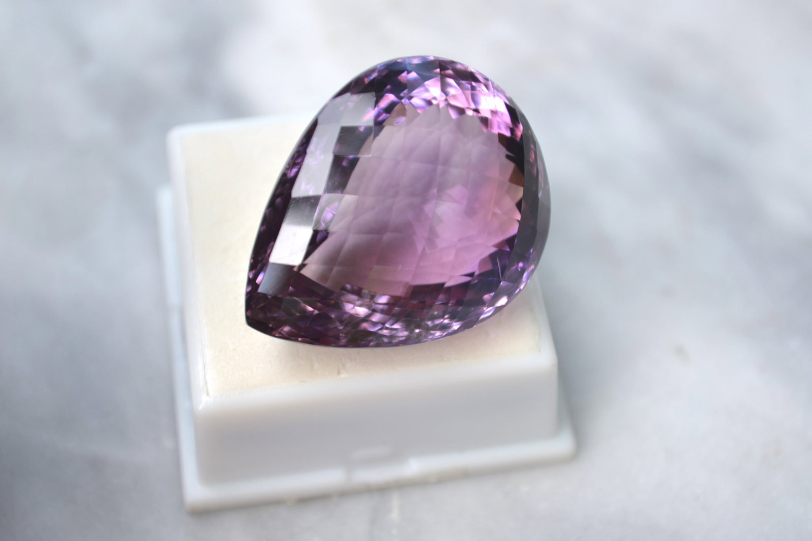 88.22 Carat Pear Checkerboard Cut Amethyst: Wow, what a large and beautiful Amethyst here. Huge and beautifully cut with good color. Priced at just $2 per carat. You won't find another stone like this at this price. Natural and untreated. Most 