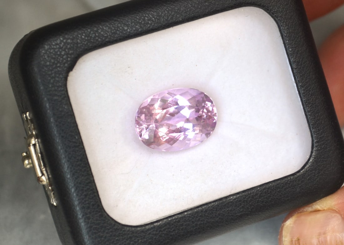 14.75 Carat Oval Cut Kunzite: Gorgeous Kunzite with nice Bubblegum Pink color and a great cut. Just a great stone. Natural and untreated. Most gems sold online aren't jewelry grade. They're either poorly cut, have weak color or