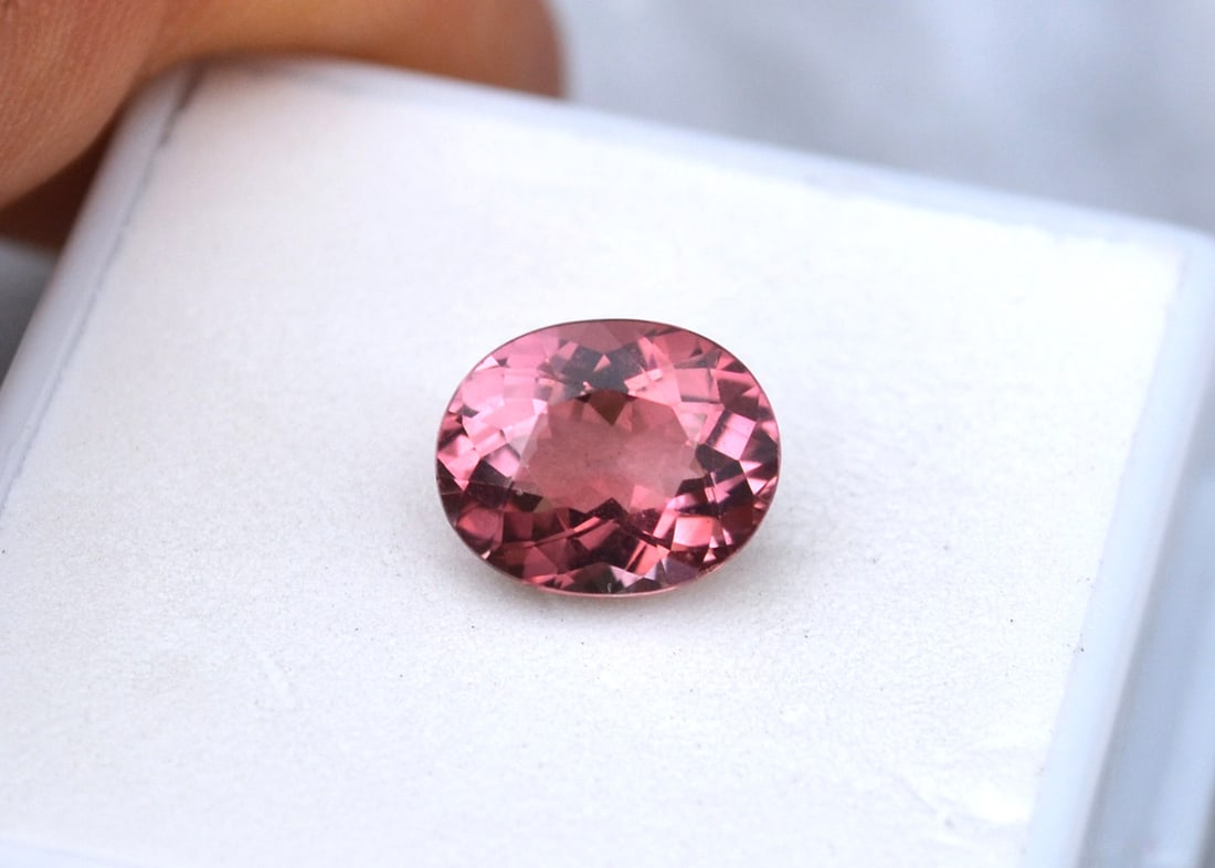 2.95 Carat Oval Cut Pink Tourmaline: Fantastic Pink Tourmaline. Great color, cutting and clarity. Just a fantastic stone for the price. Natural and untreated. Most gems sold online aren't jewelry grade. They're either poorly cut, have we