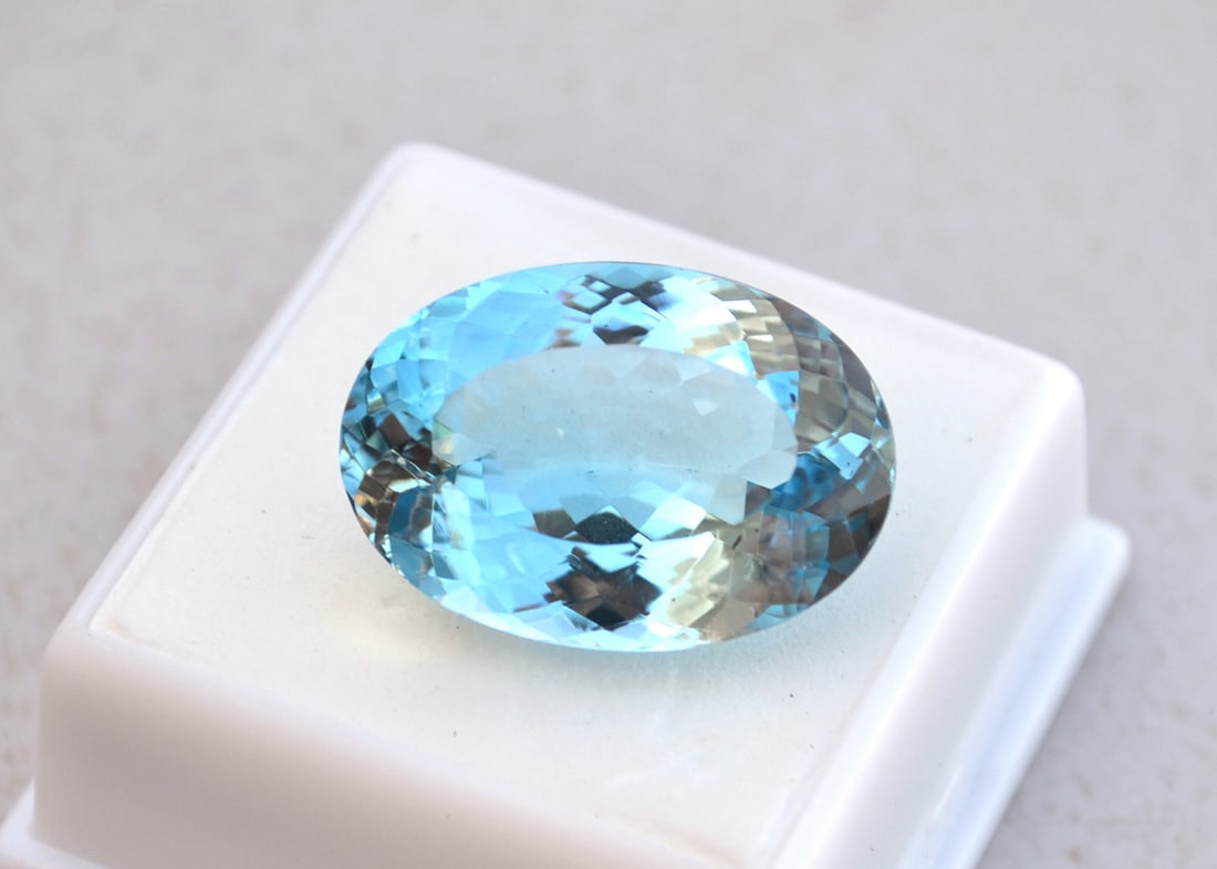 31.00 Carat Oval Cut Sky Blue Topaz: Beautiful Topaz. Top grade stone at a fraction of the price. Natural stone but heated and irradiated to get its color as all Blue Topaz are. This is an industry accepted practice that gives all Blue T
