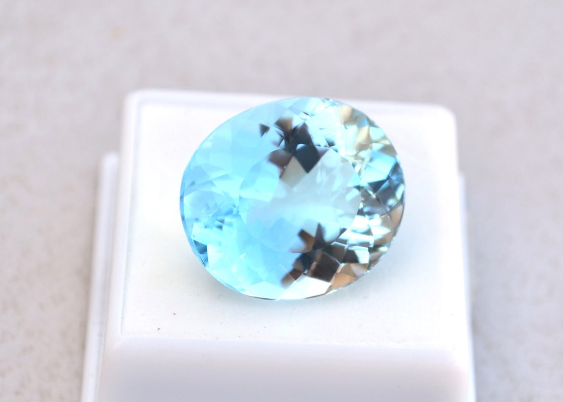 34.70 Carat Oval Cut Sky Blue Topaz: Fine Topaz with rich blue color and a great cut. Nice, larger size for jewelry. Natural stone but heated and irradiated to get its color, as all Blue Topaz are. This is an industry accepted practice a