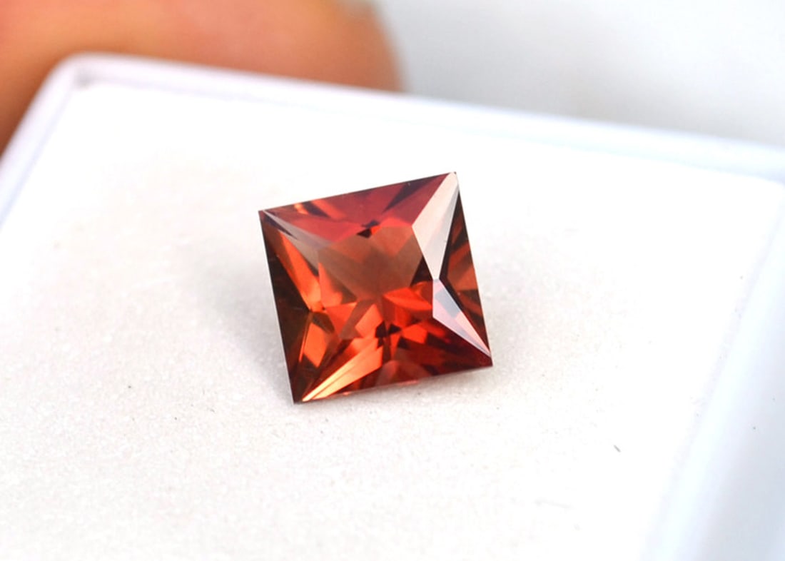 2.03 Carat Princess Cut Oregon Sunstone: Top quality Sunstone. Absolutely stunning. Most likely from Oregon, USA. This is one of the brightest, most beautiful Sunstone we've ever seen. Absolutely gorgeous color. Red Sunstone is nearly always