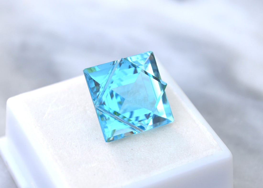 21.30 Carat Gorgeous Fancy Square Cut Topaz: Wow, what a gorgeous gem! We've not seen a gemstone cut like this before, with a thick square table set crosswise atop another square, creating a gorgeous diamond pattern. Just an exceptional stone.