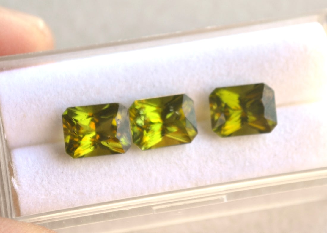 7.53 Carat Matched Trio of Scissor Cut Peridots: Beautiful matched set of Peridots! Good color and clarity and all very well cut. Natural and untreated. Most gems sold online aren't jewelry grade. They're either poorly cut, have weak color or too