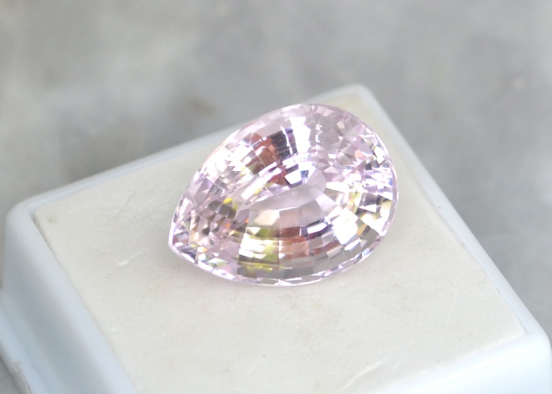 22.32 Carat Fancy Pear Cut Kunzite: Fantastic Kunzite with great color, cutting and clarity. Just a top quality stone. Natural and untreated. Most gems sold online aren't jewelry grade. They're either poorly cut, have weak color or too