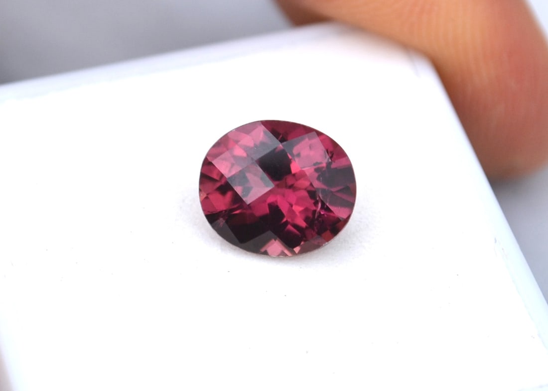 2.90 Carat Oval Checkerboard Cut Rubellite Tourmaline: Gorgeous example of this rare form of Tourmaline. Great color, cutting and minimal inclusions. Natural and untreated. For Proxibid bidders, shipping is a flat rate of $6, no matter how many lots won.