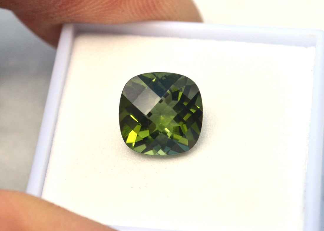 4.55 Carat Cushion Checkerboard Cut Tourmaline: Beautiful Tourmaline. Nice color and a great cut. Natural and untreated. Most gems sold online aren't jewelry grade. They're either poorly cut, have weak color or too many inclusions, giving them the 