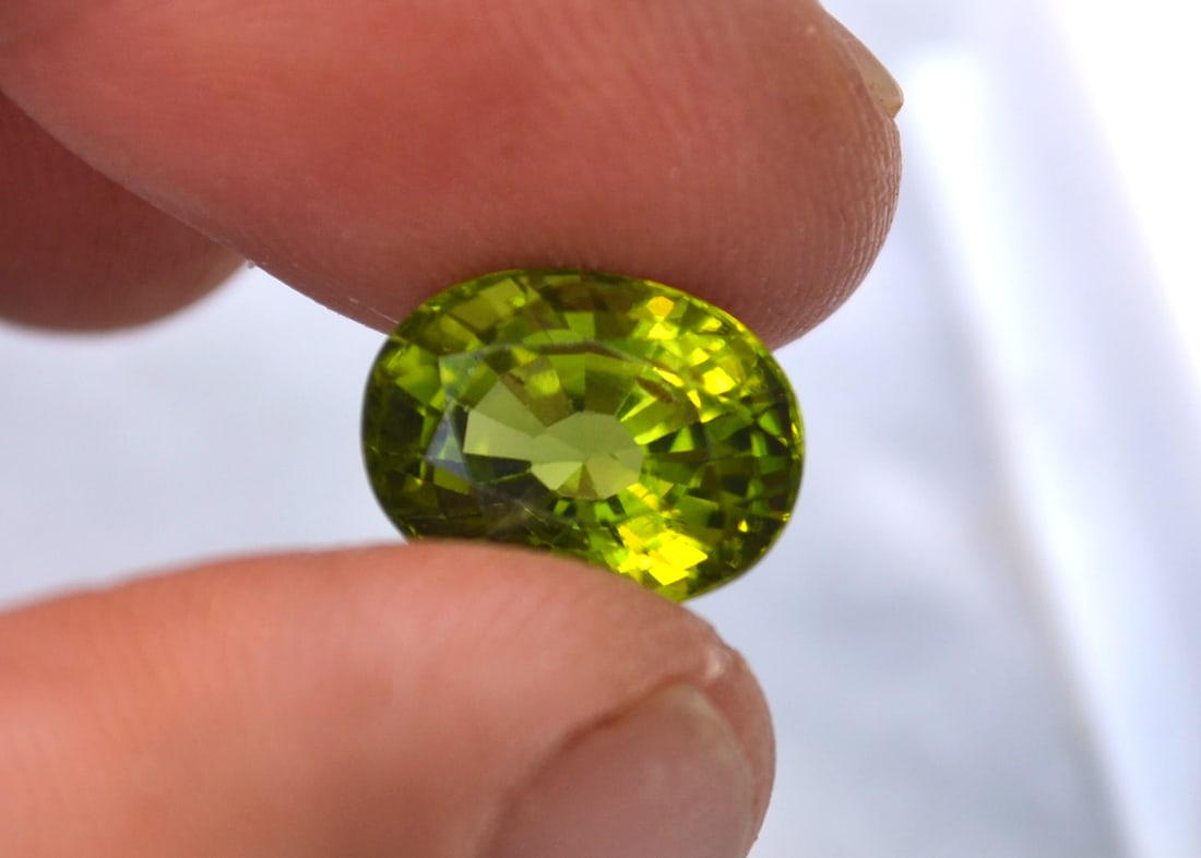 6.83 Carat Oval Cut Peridot: Stunning Peridot. One of the nicest we've had. Just a top quality stone. Natural and untreated. For Proxibid bidders, shipping is a flat rate of $6, no matter how many lots won. For Live Auctioneers