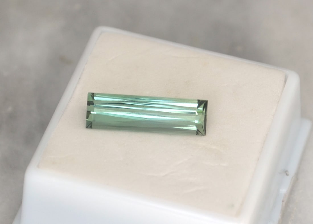5.23 Carat Scissor Cut Blue-Green Tourmaline: Nice Tourmaline with a beautiful light Blue-Green color. Great clarity and cutting also. The color is a bit on the lighter side, which is why the price is so low. Really fine Tourmaline though.