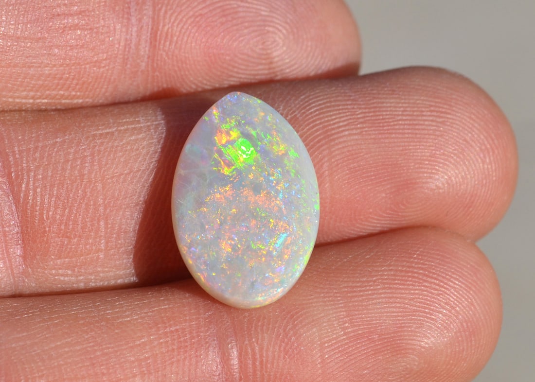 7.60 Carat Pear Coober Pedy Australia Opal: Bright and fiery Opal from Coober Pedy, Australia. Just a great example of this rare form of Opal. Australian Opals are the highest value Opals in the world, especially large, solid examples like