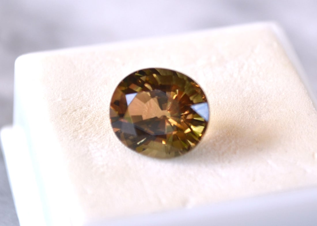 6.07 Carat Oval Cut Tricolored Tourmaline: Beautiful Tourmaline. Lots of great color. As you can see from the picture on the reverse of the gem jar, this is a multicolored Tourmaline. It's primary colors are Orange and Yellow but when the