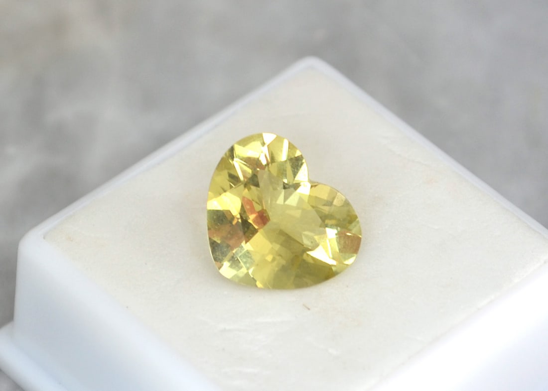 5.75 Carat Heart Shaped Heliodor: Fantastic example of a Heliodor, which is the yellow form of the gemstone familly Beryl. Heliodor is in the same family as Emerald and Aquamarine, so as you can imagine, the value is quite high.