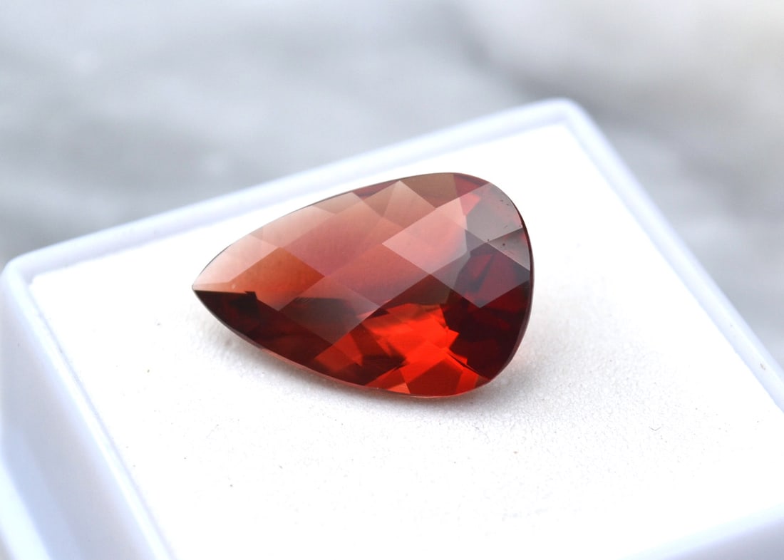 6.45 Carat Pear Checkerboard Cut Red Sunstone: Wow, what an exceptional Sunstone, most likely mined in Oregon, USA. Red Sunstone is nearly always mined in Oregon, so as you can imagine, the value is quite high. This stone has really interesting