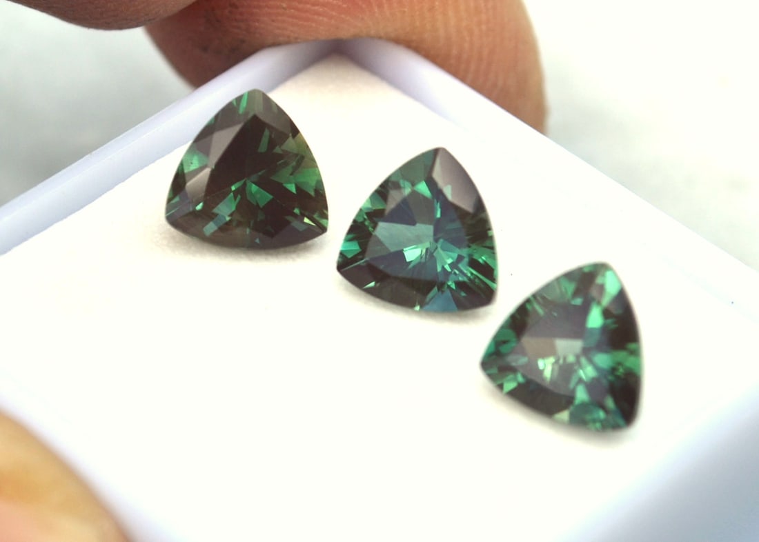 4.61 Carat Matched Trio of Trillion Cut Green Sunstone: Just exceptional Sunstones here, most likely from Oregon, USA. Green Sunstone is nearly always from Oregon, so as you can imagine, the value is quite high. This material often sells for $500 per