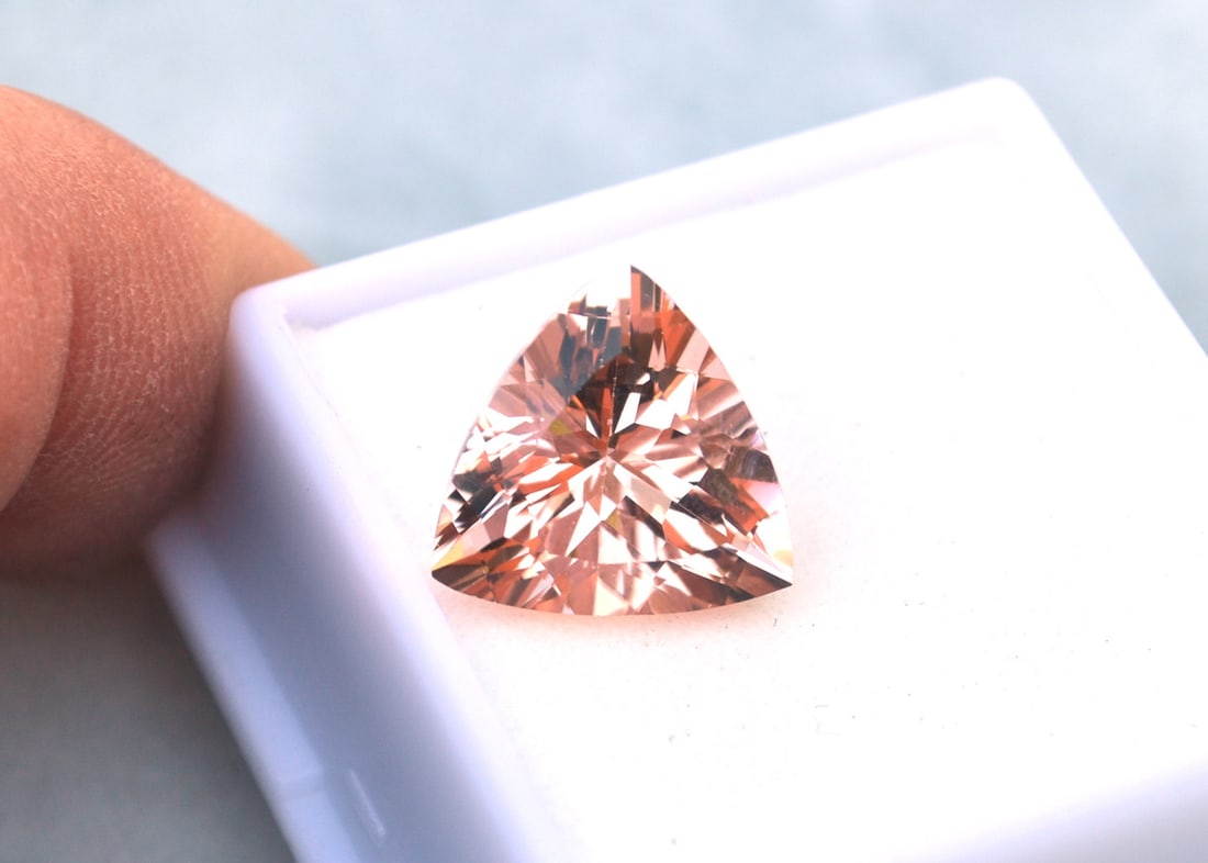 6.40 Carat Trillion Cut Morganite with Independent Wholesale Appraisal: Very nice Morganite. Great color, cutting and clarity. Exceptional stone. This gemstone comes with the pictured appraisal certificate from a GIA Graduate Gemologist in the San Diego Jewelry District. 
