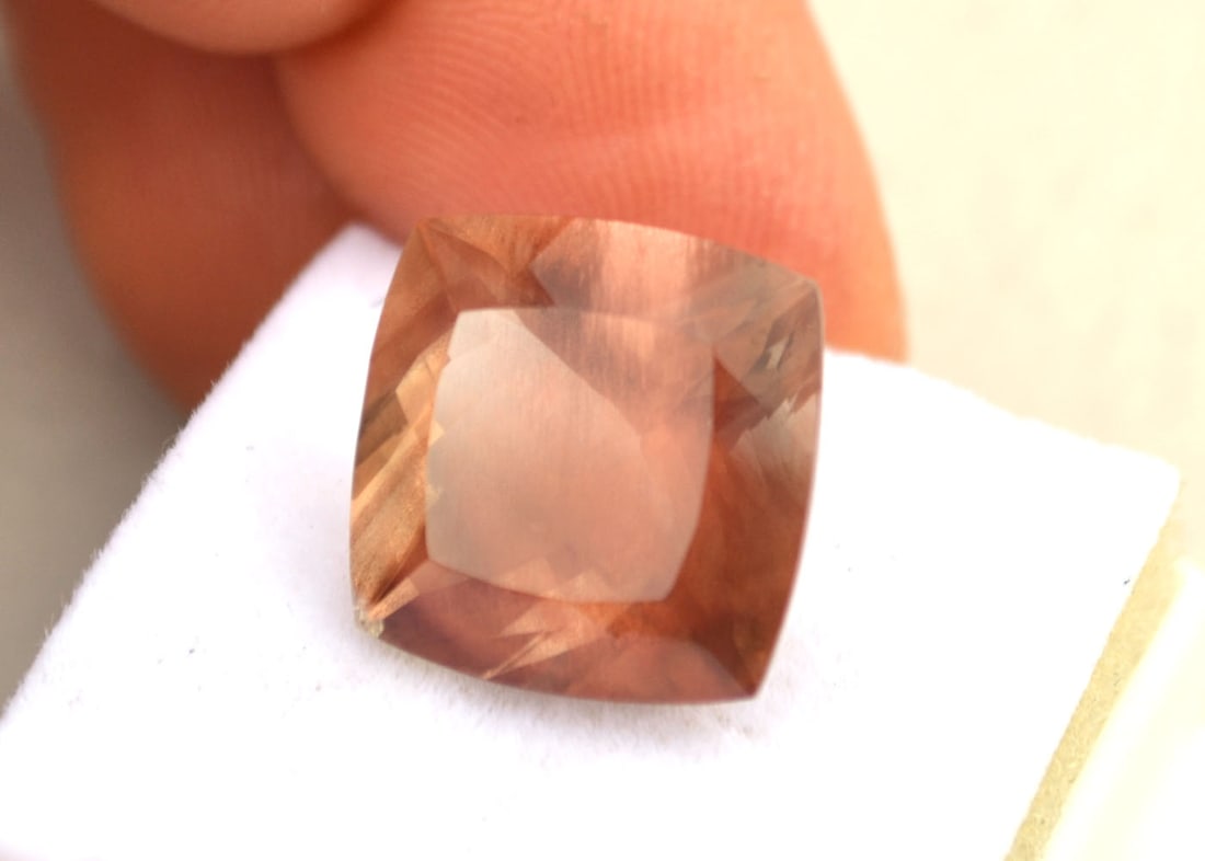 14.54 Carat Cushion Cut Sunstone with Schiller: Wow, what an incredible and large Sunstone. This Sunstone has a ton of "Schiller", which is a phenomenon completely unique to Sunstone. As you can see from the pictuers, when this stone is rotated at