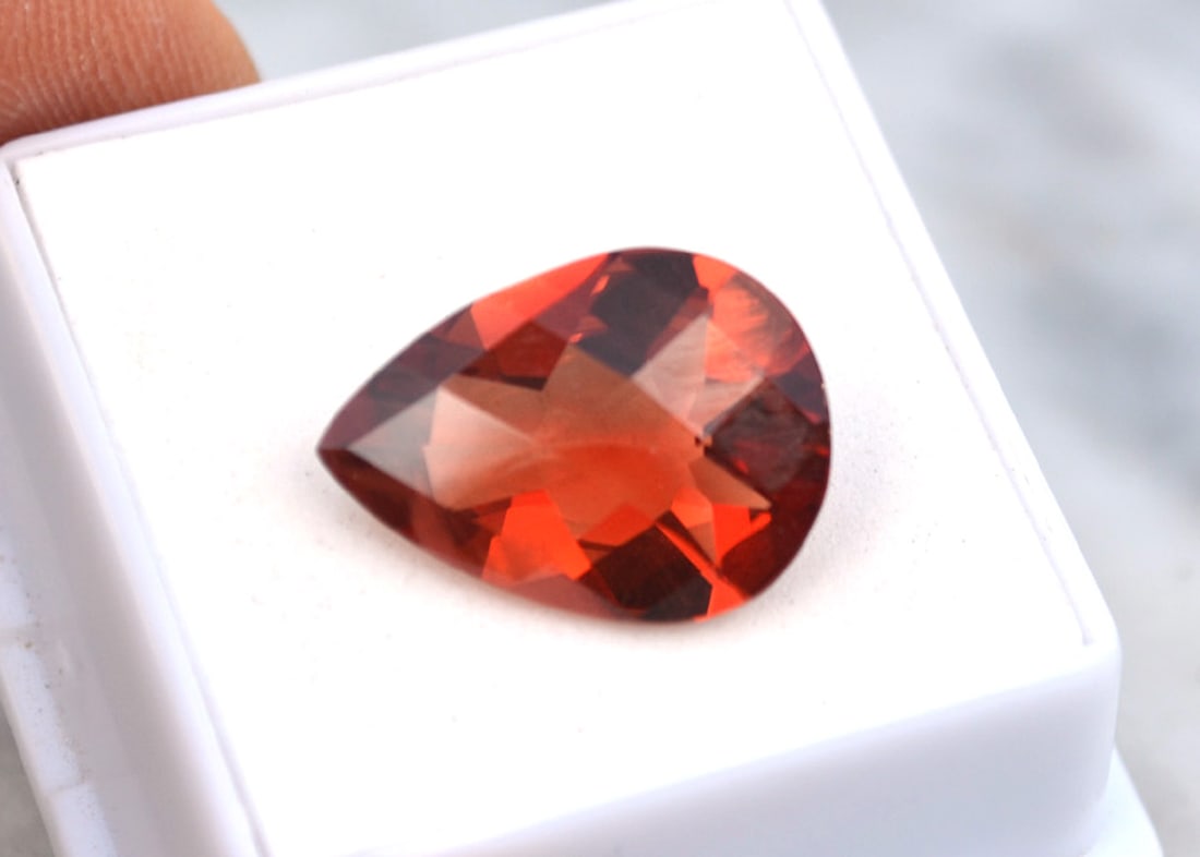 9.19 Carat Pear Checkerboard Cut Red Sunstone: Wow, what an exceptional Sunstone, most likely mined in Oregon, USA. Red Sunstone is nearly always mined in Oregon, so as you can imagine, the value is quite high. This stone is top red color and