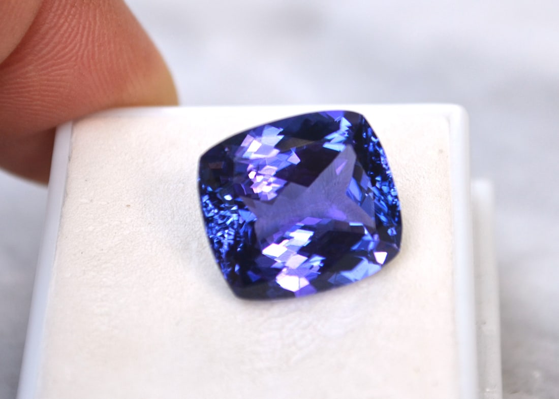 13.19 Carat GIA Certified Cushion Cut Tanzanite: Gorgeous Tanzanite. Perfect in every way. Truly a top quality stone. Top color with great cutting and clarity. You won't find a nicer Tanzanite at this price anywhere else. This stone has a strong pur