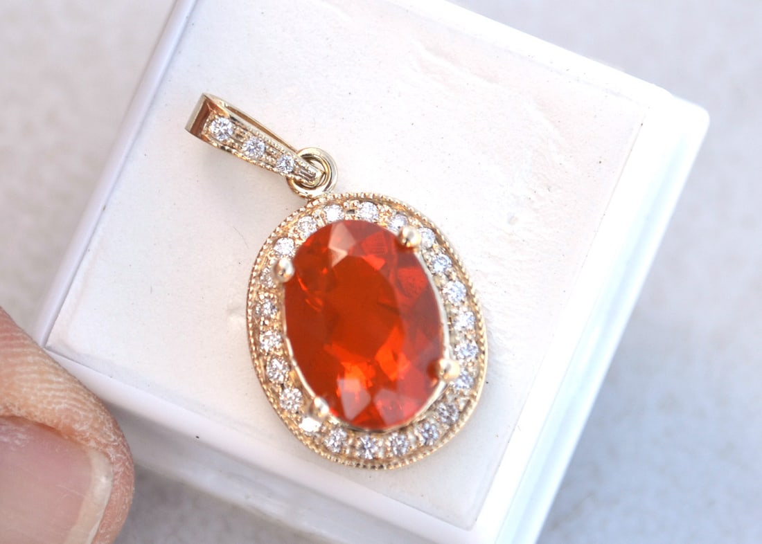 Fire Opal Pendant in 14k Gold: Exceptional pendant here, with a large and top quality orange Fire Opal. Tons of gold and diamonds. Just a top quality piece, nicer than almost anything you can even find in a jewelry store. There