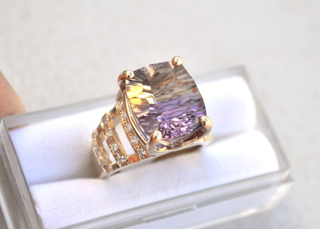 Ametrine Ring in 14k Gold: Beautiful ring with a fantastic fancy cut Ametrine. The tag on this ring has the specifications for gold quantity, size and diamond weight, along with a wholesale price for this piece. As you can