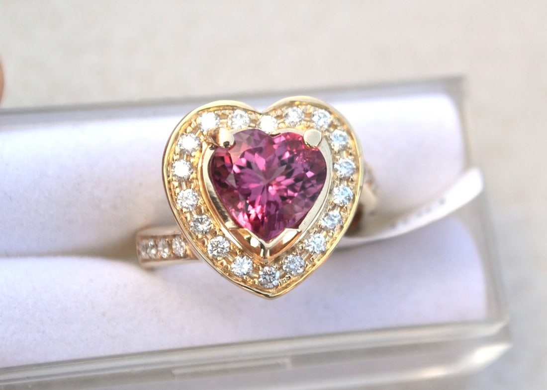 Tourmaline Ring in 14k Gold: Just an exceptional ring with a fantastic, bright and beautiful Tourmaline. The tag on this ring has the specifications for gold quantity, size and diamond weight, along with a wholesale price for