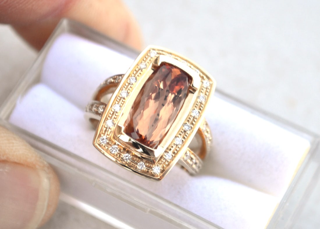 Imperial Topaz Ring in 14k Gold: Just an exceptional ring with a top quality colored Imperial Topaz. The tag on this ring has the specifications for gold quantity, size and diamond weight, along with a wholesale price for this