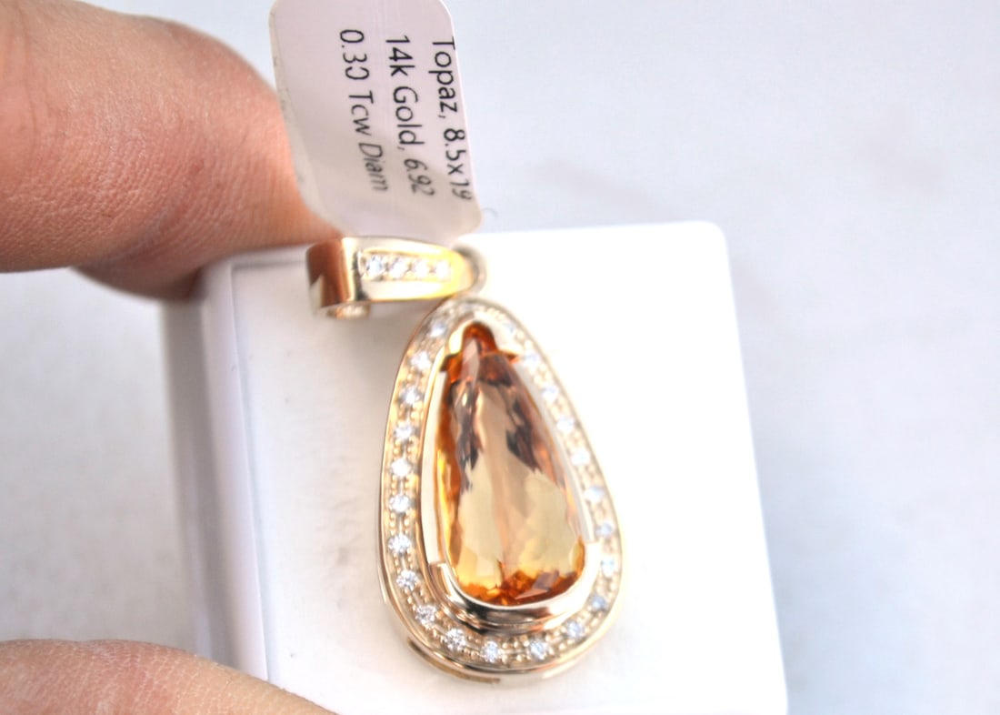 Imperial Topaz Pendant in 14k Gold: Amazing pendant, with a huge, top quality Imperial Topaz and tons of gold and diamonds. Just a top quality piece, nicer than almost anything you can even find in a jewelry store for about a quarter