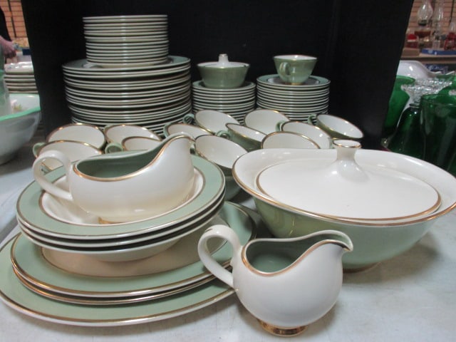122 Pieces of Taylor Smith & Taylor Classic Heritage Celadon Green Dinnerware: (28)10 1/2" plates, (15)6 5/8" plates, (18)6" bowls, (24)saucers, (27)cups, (3)9 1/2" round flat rim vegetable bowls, (2)11 1/2" oval platters, (1)13 1/2" oval platter, 11" covered vegetable bowl, cre