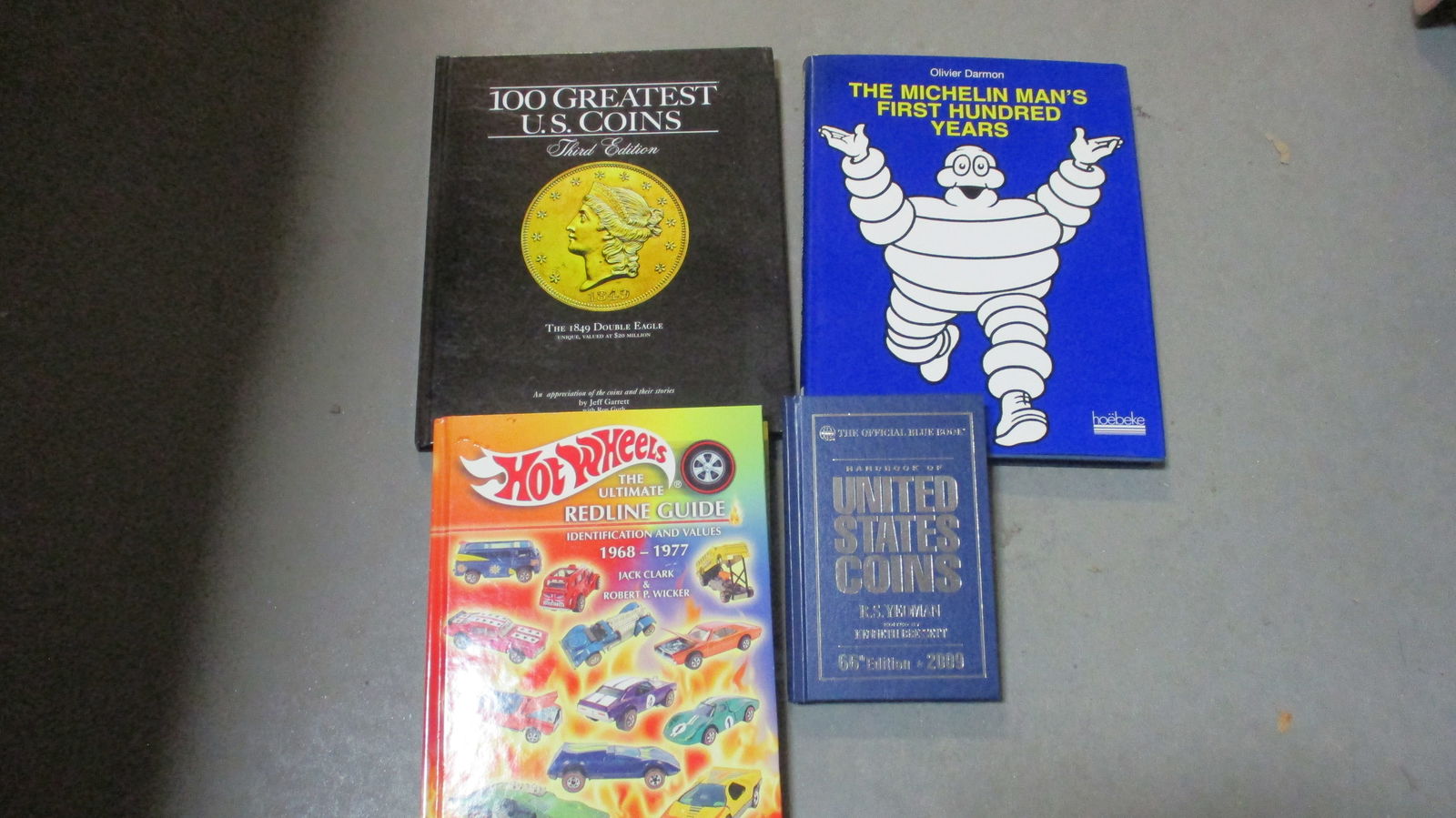 2 US Coins Books, Hot Wheels Redline Guide Book, and "The Michelin Man" Book (1 of 7)