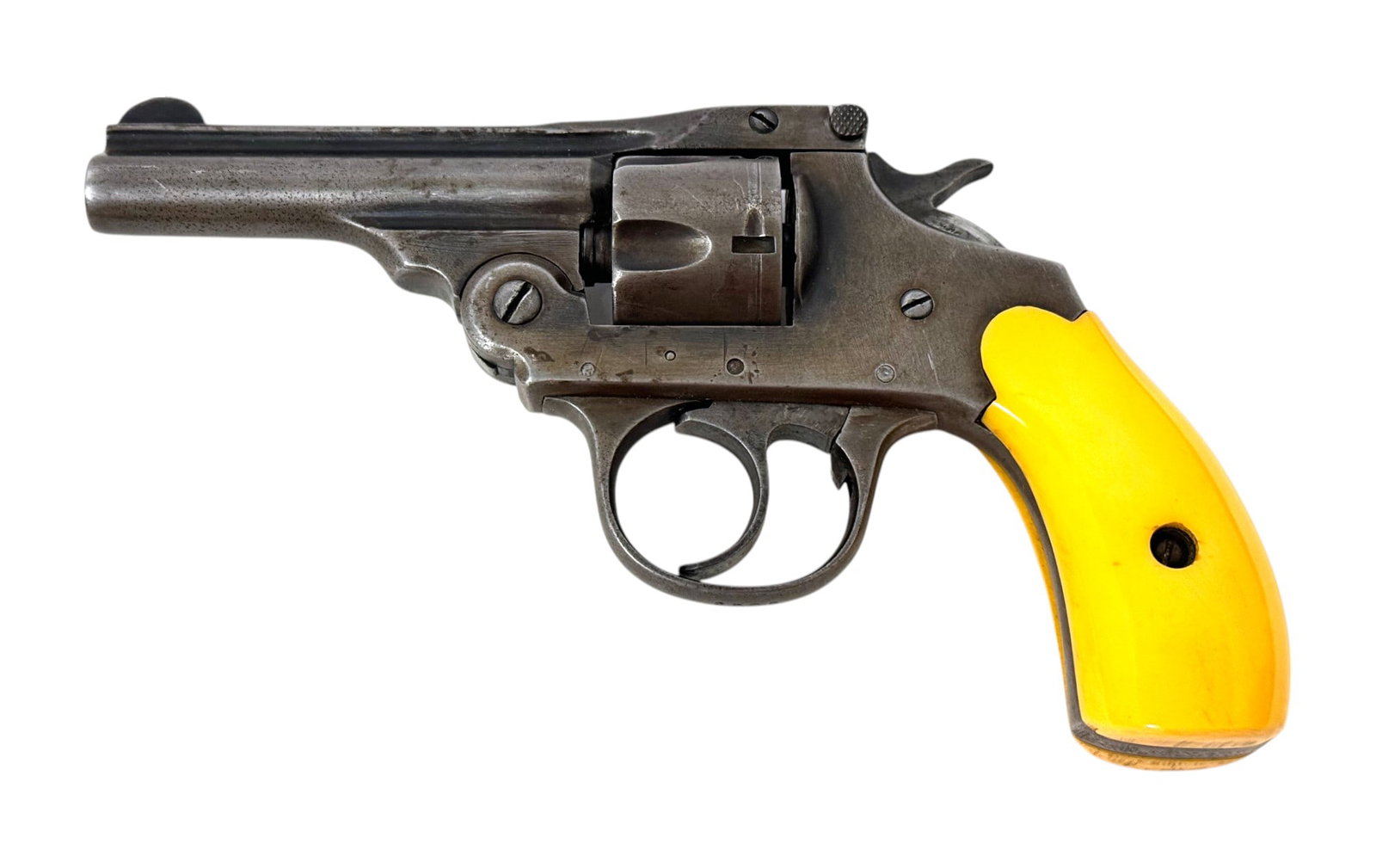 Iver Johnson .32 S&W Nickel Top-Break Revolver with John Wayne Grips: S#: 6508 | G code serial number under the left grip panel | John Wayne Yellow Plastic Grips | 5 shot SA/DA | Last patent date Nov.17.03 |||| CONDITION: Moderate. Faded gray/blue finish with scratches 