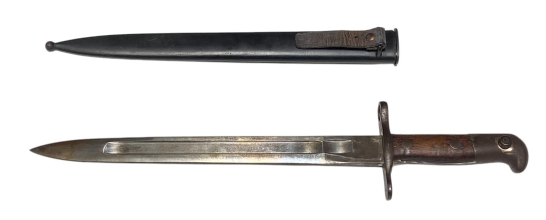 Swiss M1899 Knife Bayonet by Waffenfabrik Neuhausen with Scabbard: For use on the 7.5mm Schmidt-Rubin M1889/96 Rifle, M1911 Rifle, and Carbine | 11.75” blade. 16.5” overall length. Scabbard is missing screw | Very Good condition.