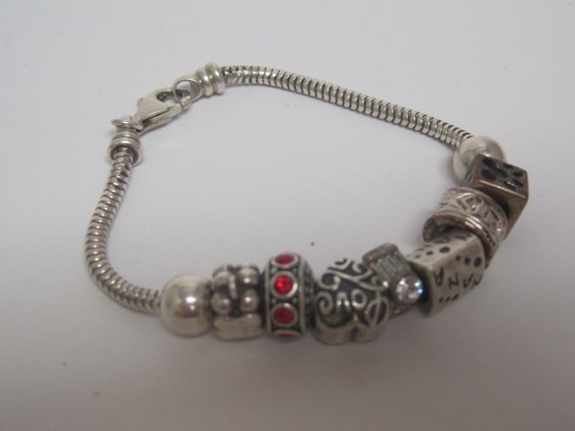 7" Sterling Silver Charm Bracelet: Weighs 22.6 grams