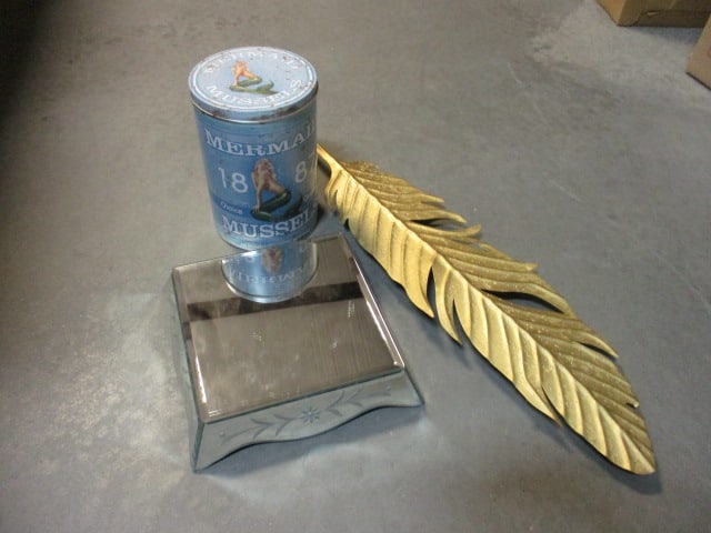 Box Lot. Retro Mermaid Tin, Decorative Gold Toned Hanging Leaf, and Mirrored Platform Base. (1 of 8)