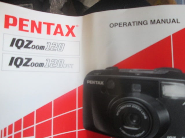 Pentax 1QZoom 120 35mm Camera in Polaroid Bag: includes roll of 200 and 400 speed film