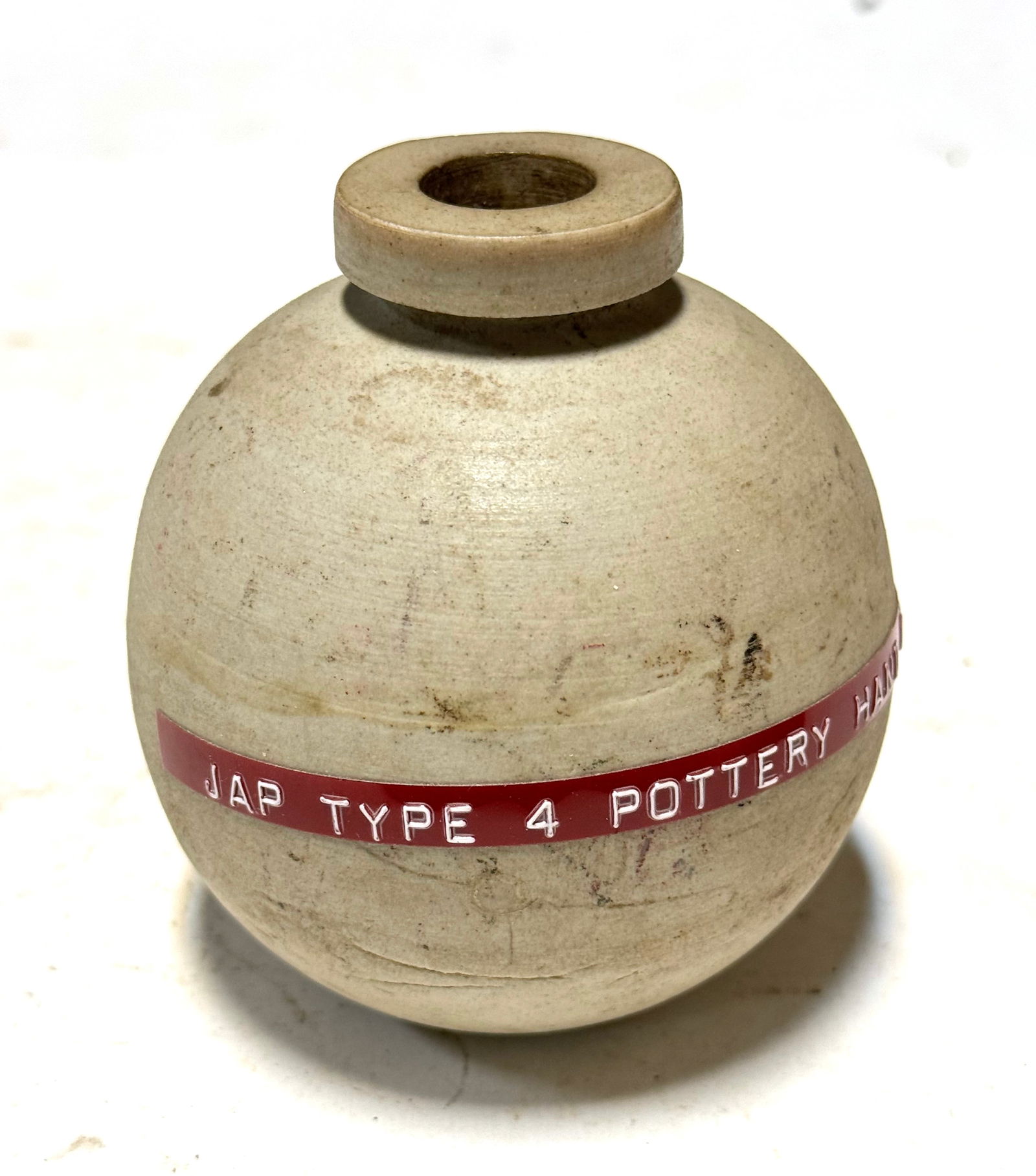 Rare Inert Japanese WWII Type 4 Ceramic Hand Grenade in Flat White Glaze: Excellent Condition. The Type 4 Grenade or Ceramic Grenade was a “last-ditch” hand grenade developed by the Imperial Japanese Navy in the closing stages of World War II.