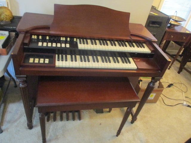 Hammond M-3 Spinet Two-Manual and Pedal Electric Organ and Bench: Organ 46" x 26" x 35, Bench with underseat storage 30" x 14 1/2" x 22 1/2", Serial No. 58253, Service chart is affixed to bench seat-First service was dated 1956 and was last serviced in 2004, has sch