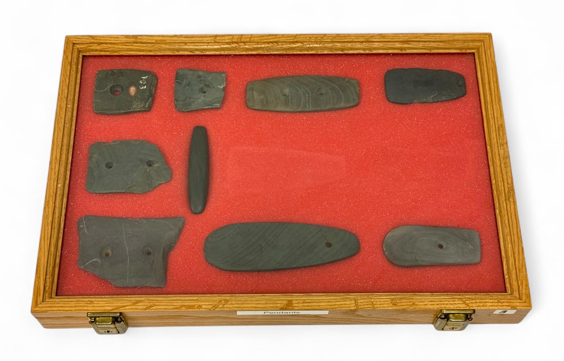 9pc. Curated Ancient Native American Slate Pendants / Gorgets Cased Display: 9 pieces in total of nice Slate pendants/gorgets mostly from Indiana, Ohio, and Illinois. Case Measures 18” x 12” and comes with Key. From X-James Ross Williams, Jr. (JRW) Collection