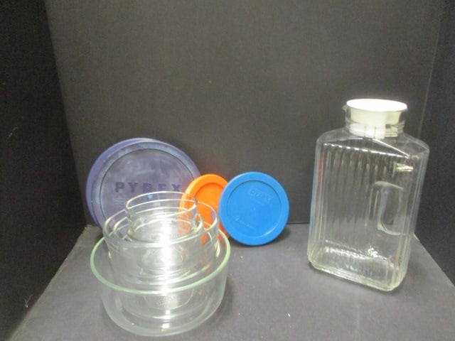 Six Clear Glass Pyrex Bowls, Four Lids and Glass Two Quart Pitcher.: See Pictures for Details.