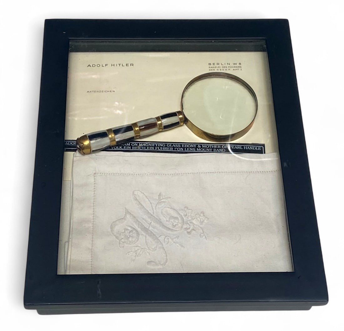 Unique German Adolf Hitler Magnifying Glass and Napkin: Adolf Hitler monogrammed Magnifying Glass with ebony & mother of pearl Handle, “ein volk, ein Reich, ein fuhrer!” Enscribed on the lens mount band. | Adolf Hitler marked napkin | Buyer be